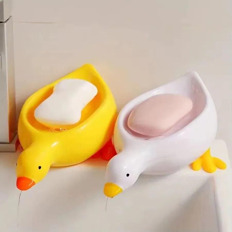 Set of 2 duck shape soap holders in bright colors, ideal for adding fun to your bathroom decor.