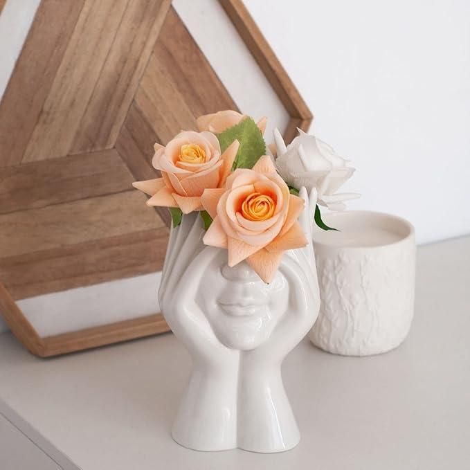Aesthetic face vase by 1h8x0d-zb featuring a unique design with facial features and a smooth ceramic finish.