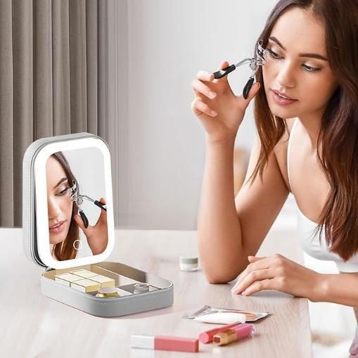 White jewelry box with LED mirror, showcasing elegant design and spacious interior for organizing accessories.