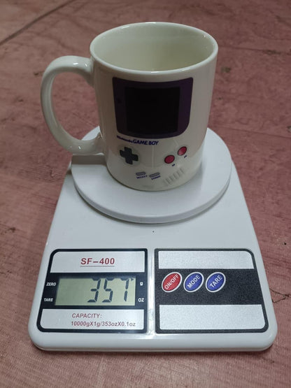 Gameboy heat changing coffee mug by 1h8x0d-zb, showing a retro design that transforms with hot liquid.