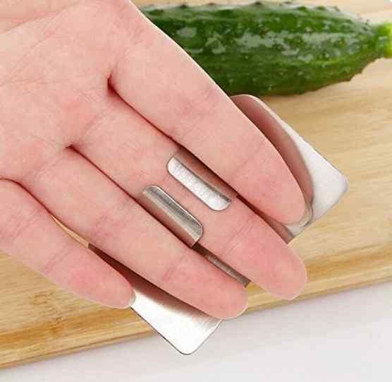 Stainless steel finger protector hand guards from 1h8x0d-zb, showing two protective devices for safe handling in the kitchen.