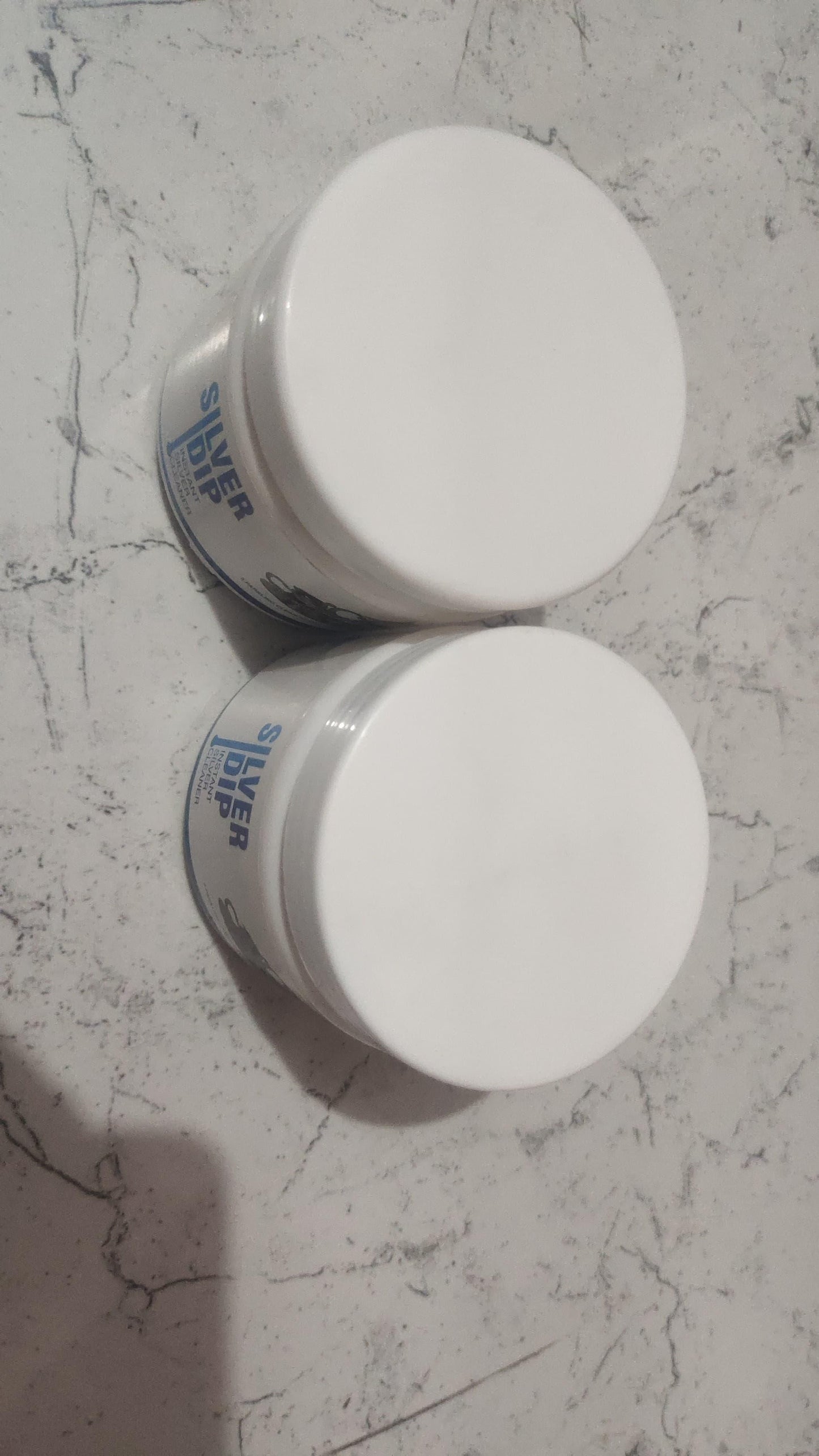 Two bottles of 1h8x0d-zb Silver Dip Instant Silver Cleaner on a white background.