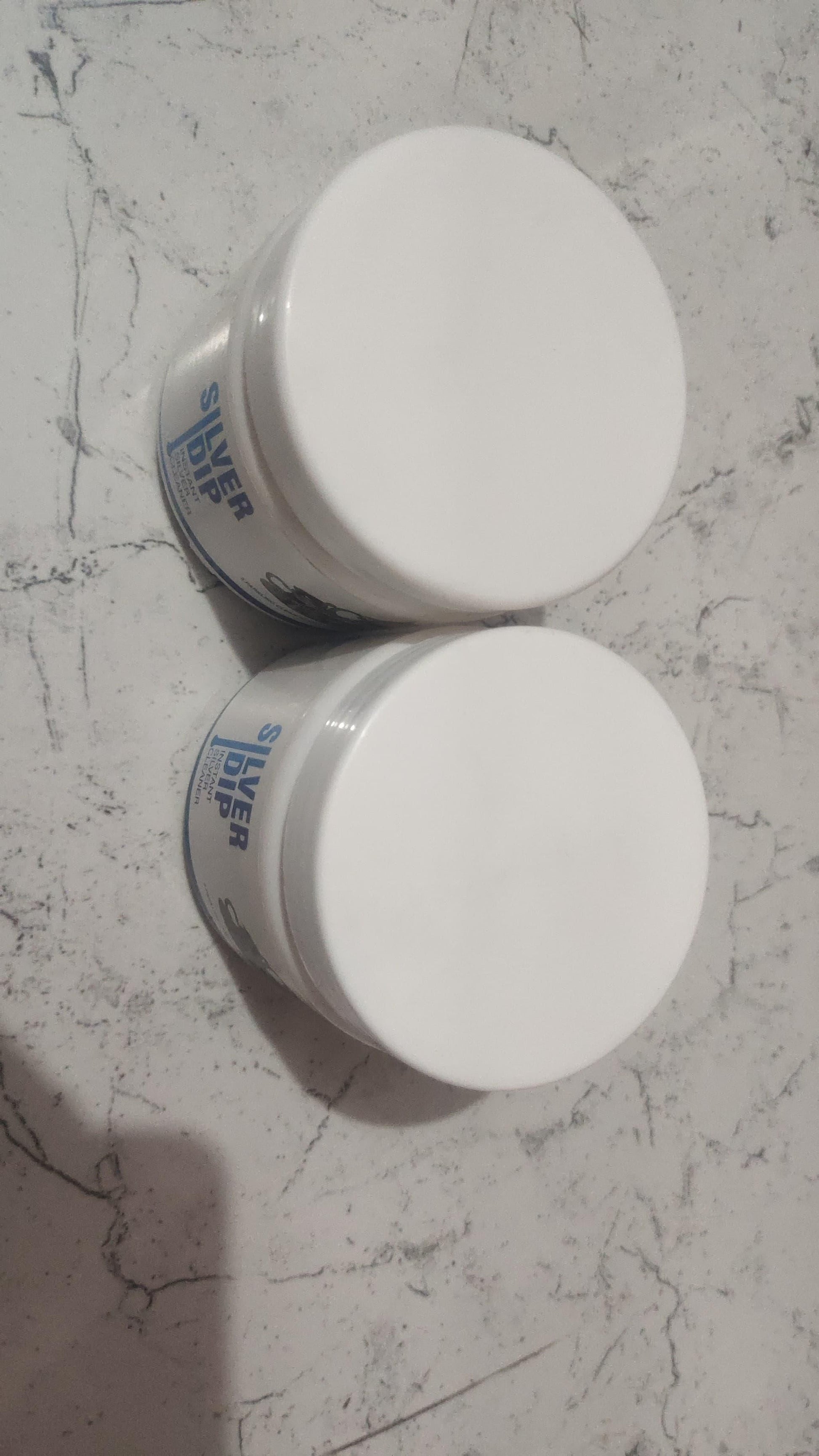 Two bottles of 1h8x0d-zb Silver Dip Instant Silver Cleaner on a white background.