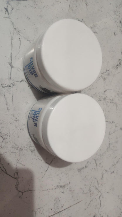 Two bottles of 1h8x0d-zb Silver Dip Instant Silver Cleaner on a white background.