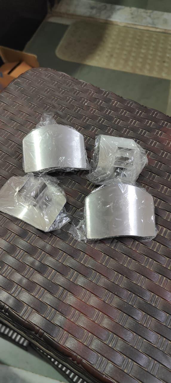 Stainless steel finger protector hand guards, pack of 2, designed for safety in kitchen tasks, shown from the side.