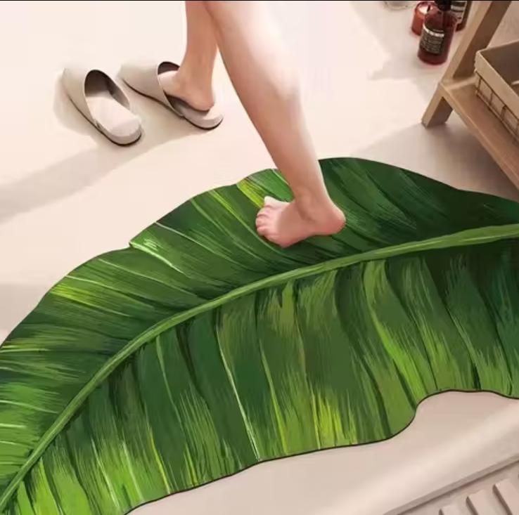 Banana leaf bathroom mat by 1h8x0d-zb, featuring an anti-slip design and a vibrant green leaf pattern.