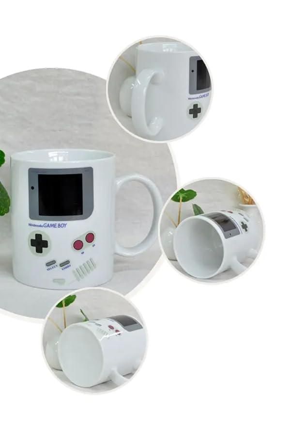 Gameboy heat changing coffee mug by 1h8x0d-zb, featuring a retro gaming design that reveals colors when filled with hot liquid.