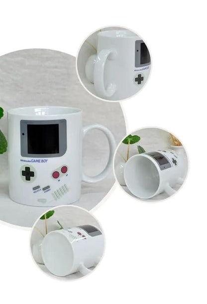 Gameboy heat changing coffee mug by 1h8x0d-zb, featuring a retro gaming design that reveals colors when filled with hot liquid.