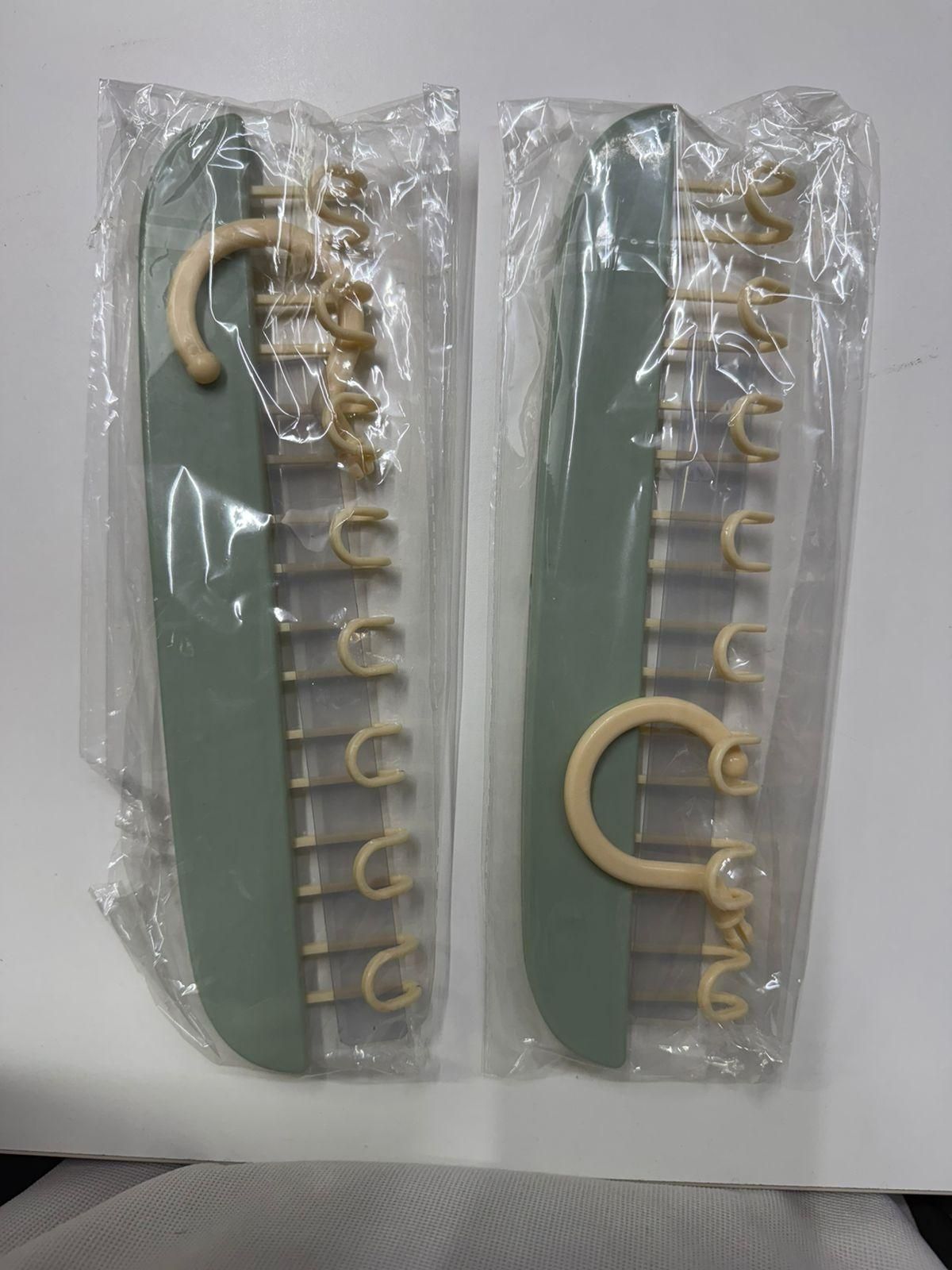 Multifunctional plastic hangers with metal hooks, pack of 2, in a stylish design, showcasing versatility for organizing clothes.