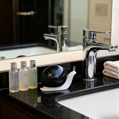 Portable snail-shaped liquid soap dispenser in soft colors, holding 120ml of soap by 1h8x0d-zb.