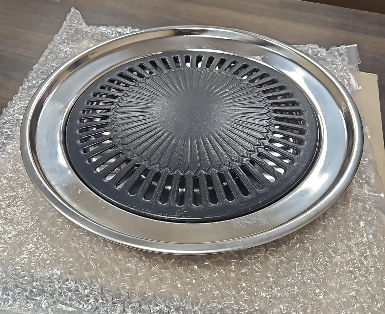Indoor gas smokeless barbeque grill by 1h8x0d-zb with grilling surface and smoke-free design for indoor cooking.