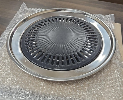 Indoor gas smokeless barbeque grill by 1h8x0d-zb with grilling surface and smoke-free design for indoor cooking.