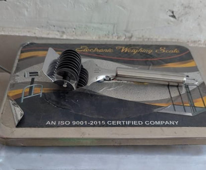 Stainless steel handheld dough and manual noodle pasta cutter tool by 1h8x0d-zb on a wooden surface.