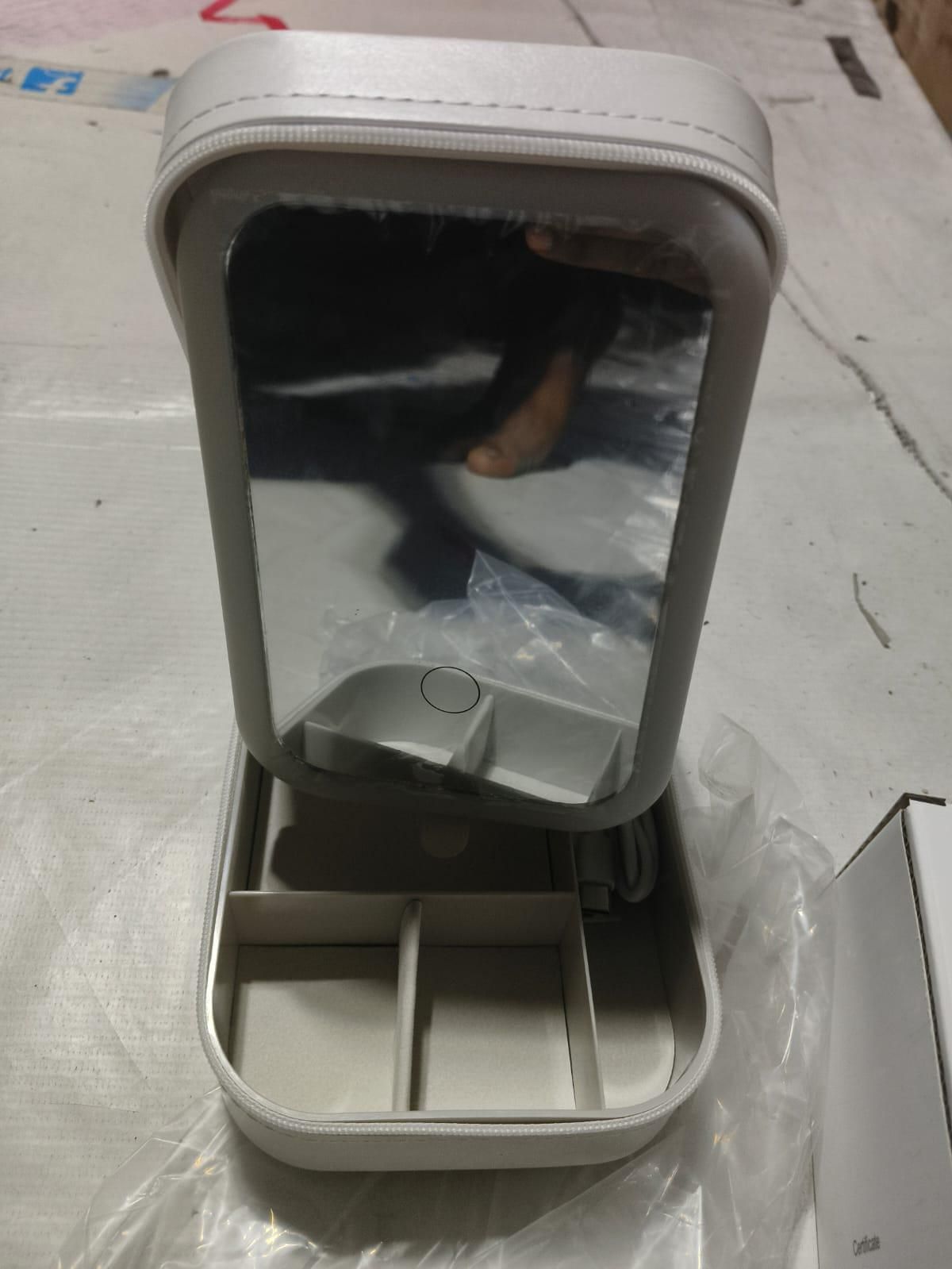 White jewelry box with LED mirror, featuring sleek design and spacious compartments for organizing accessories.